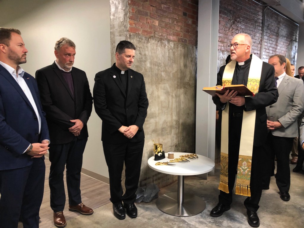 Father Aidan Rooney blesses TReC 616 Niagara business incubator. Niagara Falls.
