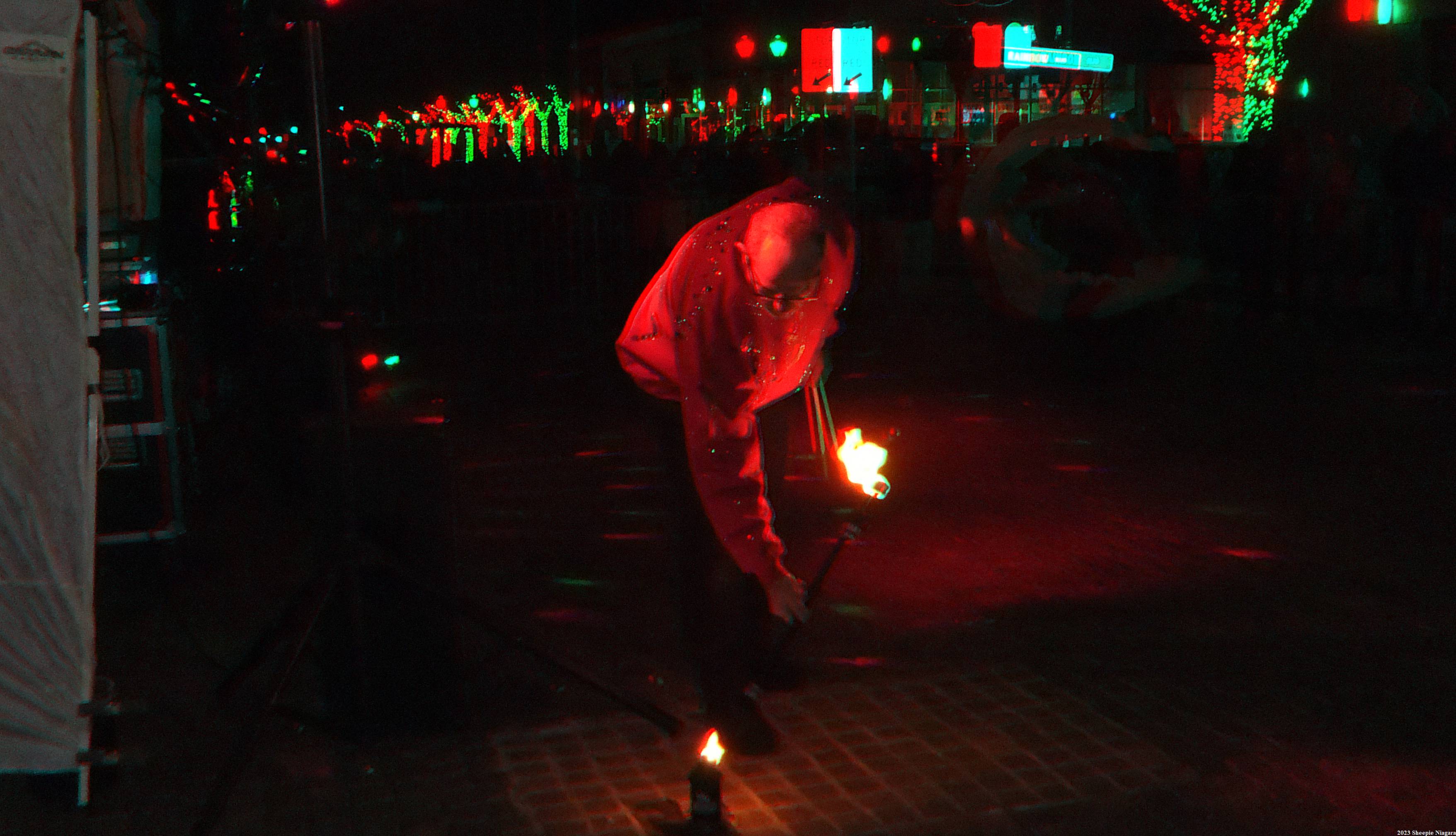Anaglyph 3D view of a fire dance performance on Old Falls Street, Niagara Falls, NY